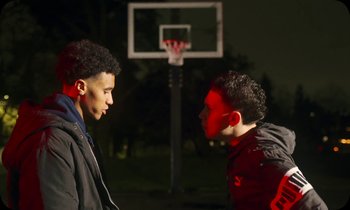 Movie still from “Oblé Reed - WESTON” (2023), directed by Nash Pearson – Medium shot, Over the shoulder angle