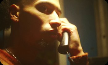 Movie still from “Oblé Reed - WESTON” (2023), directed by Nash Pearson – Extreme Close Up shot, Low angle