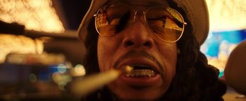Movie still from “Quavo x Takeoff - Hotel Lobby” (2022), directed by Keemotion – Extreme Close Up shot, Low angle