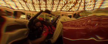 Movie still from “Quavo x Takeoff - Hotel Lobby” (2022), directed by Keemotion – Medium shot, Low angle