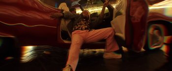Movie still from “Quavo x Takeoff - Hotel Lobby” (2022), directed by Keemotion – Medium shot, Low angle