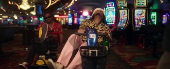 Movie still from “Quavo x Takeoff - Hotel Lobby” (2022), directed by Keemotion – Medium shot, Low angle