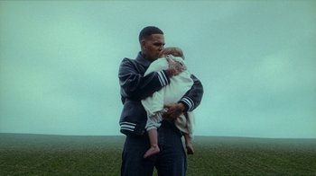 Movie still from “slowthai - Yum” (2023), directed by Owls – Medium shot, Low angle