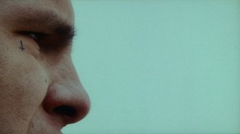 Movie still from “slowthai - Yum” (2023), directed by Owls – Extreme Close Up shot, Low angle