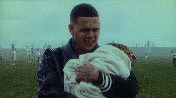 Movie still from “slowthai - Yum” (2023), directed by Owls – Close Up shot, High angle