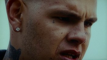 Movie still from “slowthai - Yum” (2023), directed by Owls – Extreme Close Up shot, High angle