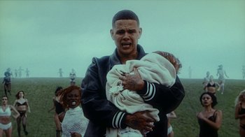 Movie still from “slowthai - Yum” (2023), directed by Owls – Medium shot, Low angle