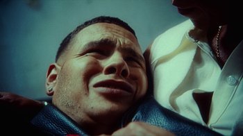 Movie still from “slowthai - Yum” (2023), directed by Owls – Extreme Close Up shot, Low angle