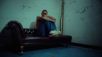 Movie still from “slowthai - Yum” (2023), directed by Owls – Wide shot, High angle