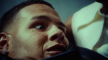 Movie still from “slowthai - Yum” (2023), directed by Owls – Extreme Close Up shot, Low angle