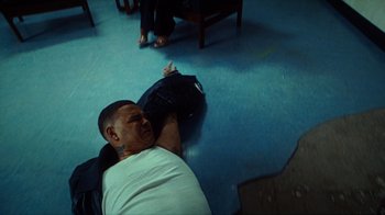 Movie still from “slowthai - Yum” (2023), directed by Owls – Medium shot, Overhead angle