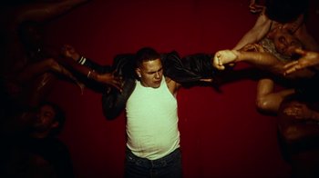 Movie still from “slowthai - Yum” (2023), directed by Owls – Medium shot, Low angle