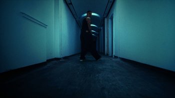 Movie still from “slowthai - Yum” (2023), directed by Owls – Wide shot, Low angle