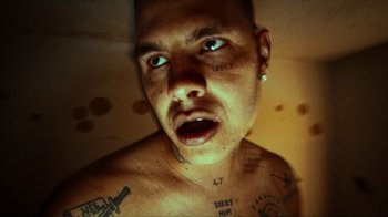 Movie still from “slowthai - Yum” (2023), directed by Owls – Extreme Close Up shot, Low angle