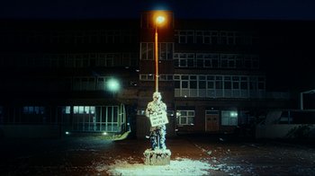 Movie still from “slowthai - Yum” (2023), directed by Owls – Wide shot, Low angle