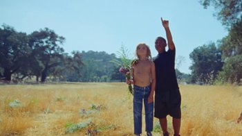 Movie still from “A$AP Rocky - Kids Turned Out Fine” (2019), directed by Dexter Navy – Wide shot, Low angle