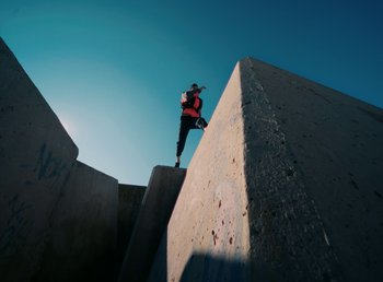 Movie still from “DJ Pone (ft. Blasé) - All I Want” (2023), directed by Benoît Marzouvanlian – Extreme Wide shot, Low angle