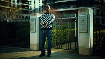Movie still from “Downtown Kayoto - Lite” (2023), directed by Joe Howat – Medium shot, Low angle