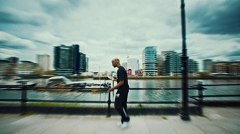 Movie still from “Downtown Kayoto - Lite” (2023), directed by Joe Howat – Wide shot, Low angle