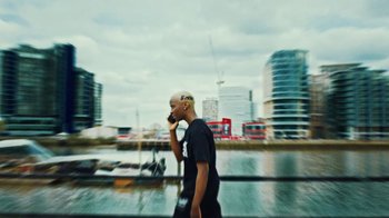 Movie still from “Downtown Kayoto - Lite” (2023), directed by Joe Howat – Medium shot, Low angle