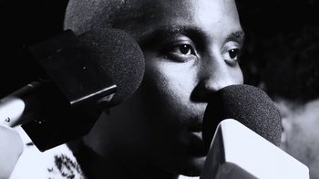 Movie still from “Downtown Kayoto - Lite” (2023), directed by Joe Howat – Extreme Close Up shot, Low angle