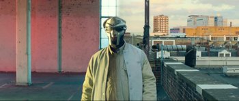 Movie still from “JJ DOOM - GUV'NOR” (2012), directed by Ninian Doff – Medium shot, Low angle