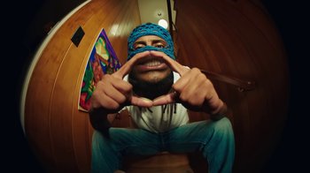 Movie still from “Aminé - Charmander” (2021), directed by Jack Begert – Extreme Close Up shot, Overhead angle