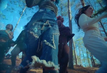 Movie still from “YUNGBLUD feat. Lil Yachty - When We Die” (2024), directed by Logan Fields – Medium shot, Low angle