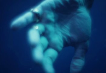 Movie still from “YUNGBLUD feat. Lil Yachty - When We Die” (2024), directed by Logan Fields – Extreme Close Up shot, Overhead angle