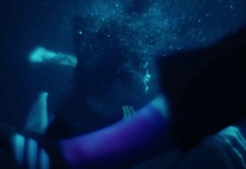 Movie still from “YUNGBLUD feat. Lil Yachty - When We Die” (2024), directed by Logan Fields – Medium shot, Overhead angle