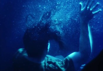 Movie still from “YUNGBLUD feat. Lil Yachty - When We Die” (2024), directed by Logan Fields – Medium shot, Overhead angle