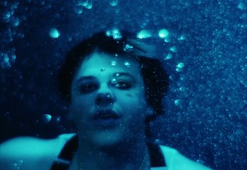 Movie still from “YUNGBLUD feat. Lil Yachty - When We Die” (2024), directed by Logan Fields – Close Up shot, Overhead angle