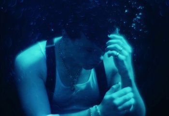 Movie still from “YUNGBLUD feat. Lil Yachty - When We Die” (2024), directed by Logan Fields – Medium shot, Overhead angle