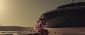 Movie still from “Drake, 21 Savage - Spin Bout U” (2023), directed by Dave Meyers – Medium shot, Low angle