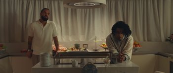 Movie still from “Drake, 21 Savage - Spin Bout U” (2023), directed by Dave Meyers – Medium shot, Low angle