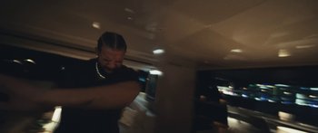 Movie still from “Drake, 21 Savage - Spin Bout U” (2023), directed by Dave Meyers – Extreme Close Up shot, Over the shoulder angle