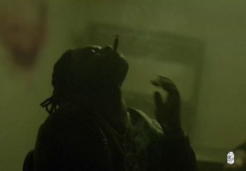 Movie still from “Ken Carson - Fighting My Demons” (2023), directed by Cole Bennett – Medium shot, Low angle