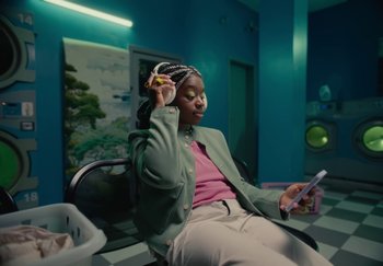 Movie still from “ONHA - KODAK” (2024), directed by Nitram – Medium shot, Low angle