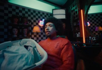 Movie still from “ONHA - KODAK” (2024), directed by Nitram – Medium shot, Low angle