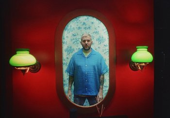 Movie still from “Dillon Francis, Good Times Ahead - LA On Acid” (2023), directed by Parker Seaman – Medium shot, Low angle