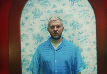 Movie still from “Dillon Francis, Good Times Ahead - LA On Acid” (2023), directed by Parker Seaman – Medium shot, Low angle