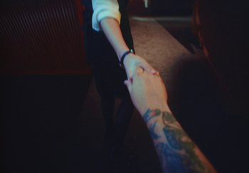 Movie still from “Dillon Francis, Good Times Ahead - LA On Acid” (2023), directed by Parker Seaman – Extreme Close Up shot, Overhead angle