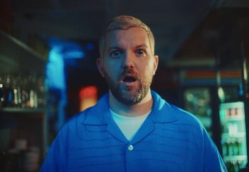 Movie still from “Dillon Francis, Good Times Ahead - LA On Acid” (2023), directed by Parker Seaman – Close Up shot, Low angle