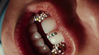 Movie still from “Audrey Nuna - Cellulite” (2023), directed by Zac Dov – Extreme Close Up shot, Overhead angle
