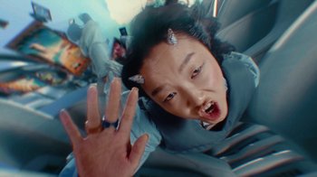 Movie still from “Audrey Nuna - Cellulite” (2023), directed by Zac Dov – Extreme Close Up shot, Overhead angle