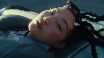 Movie still from “Audrey Nuna - Cellulite” (2023), directed by Zac Dov – Close Up shot, High angle