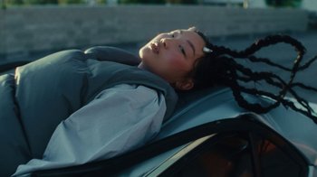 Movie still from “Audrey Nuna - Cellulite” (2023), directed by Zac Dov – Close Up shot, High angle