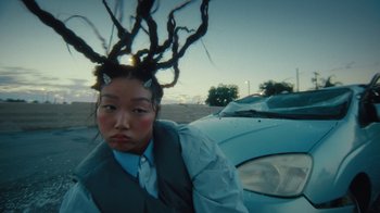 Movie still from “Audrey Nuna - Cellulite” (2023), directed by Zac Dov – Close Up shot, Low angle