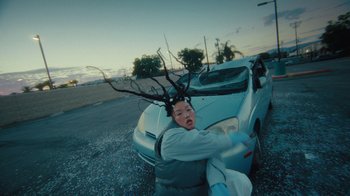 Movie still from “Audrey Nuna - Cellulite” (2023), directed by Zac Dov – Medium shot, Low angle