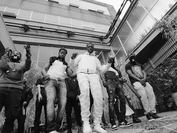 Movie still from “Pa Salieu feat. BackRoad Gee - My Family” (2020), directed by Femi Ladi – Medium shot, Low angle